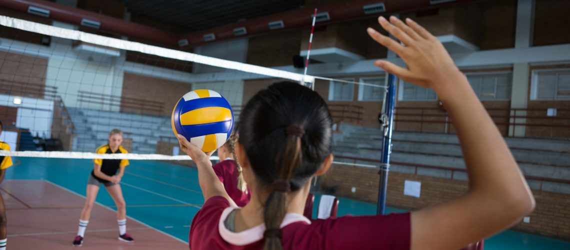 Female Players Playing Volleyball In The Court 1