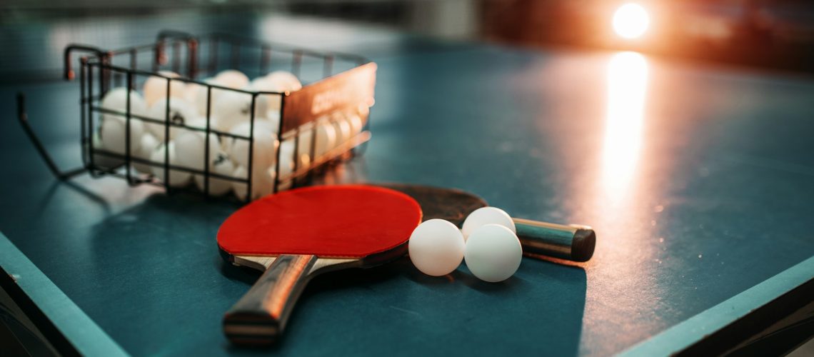 Ping Pong Table Rackets And Balls In A Sport Hall